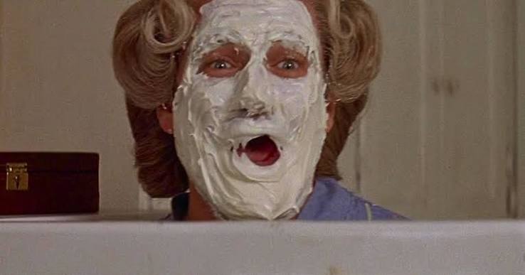 Robin Williams with face covered in pie, from Mrs. Doubtfire.
